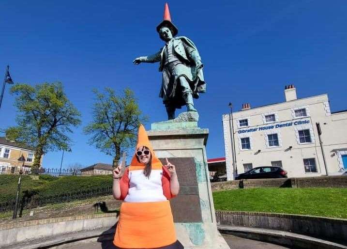Dressed as a traffic cone in front of the Thomas Waghorn statue in Chatham