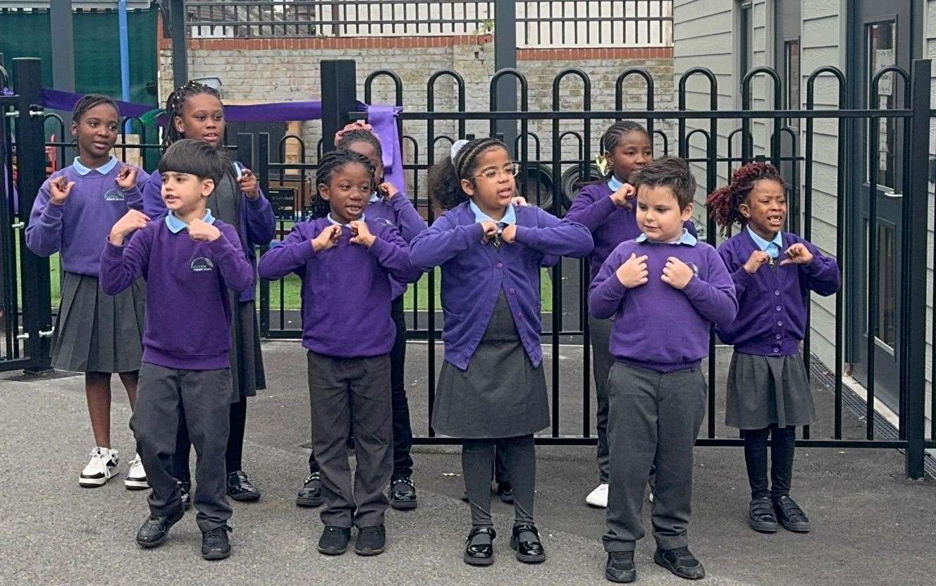 Pupils from Luton Primary School celebrate the opening of the nursery