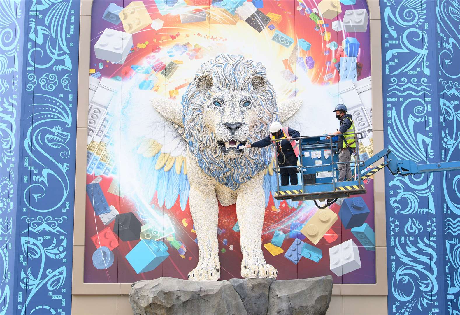 Chief Model Maker Paula Laughton gets up close to Maximus who features in the Flight of the Sky Lion ride