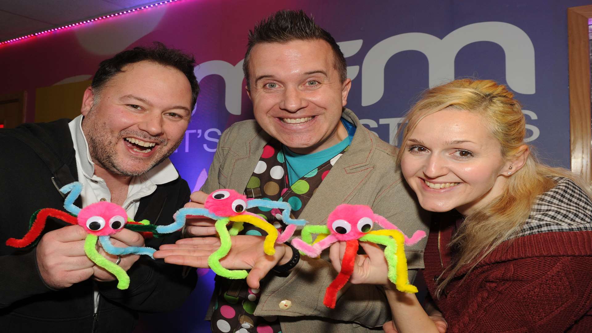 Cbeebies star Mister Maker, aka Phil Gallagher, makes Pom Pom bugs with kmfm breakfast presenters Garry and Emma