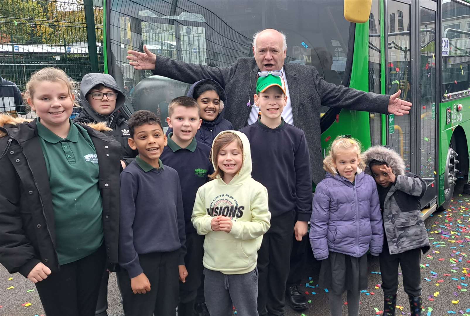 Nu-Venture boss Norma Kemp with pupils by the bus he has donated