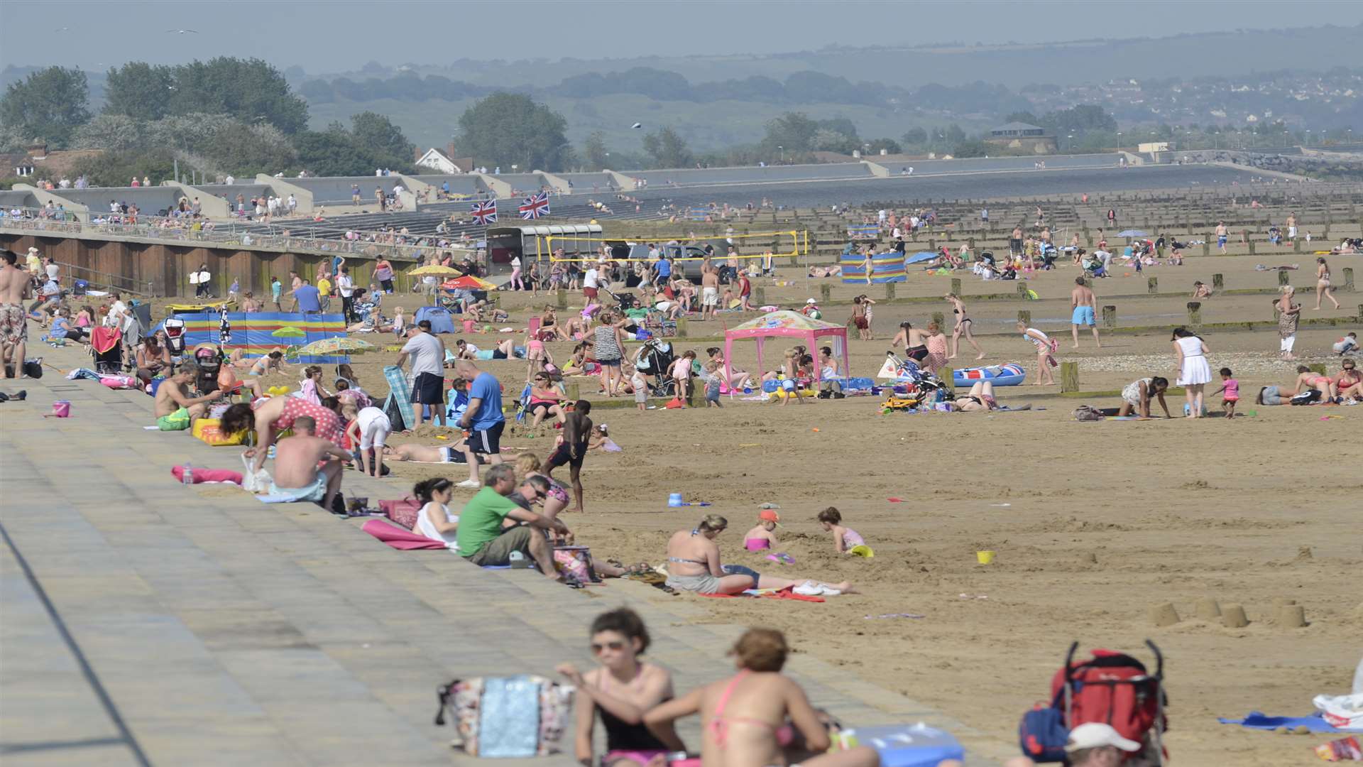 Bathers bask on Dymchurch Beach