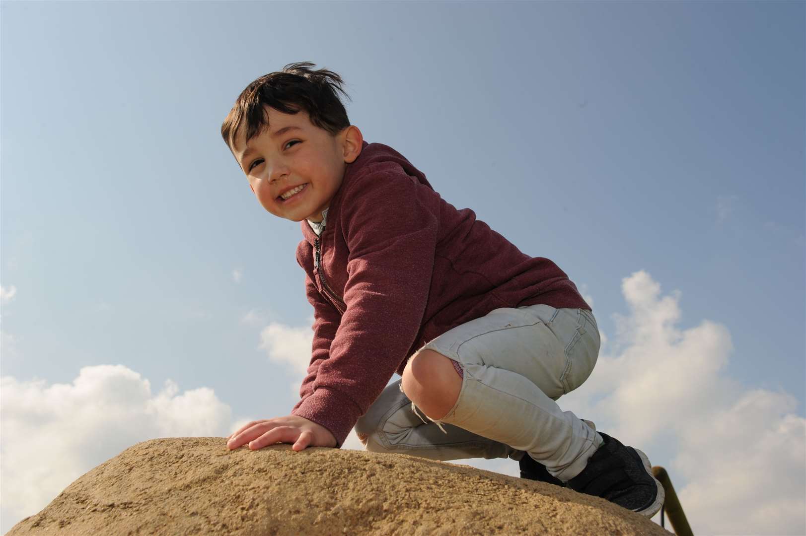 Jack, age four, on top of one of the big boulders for climbing