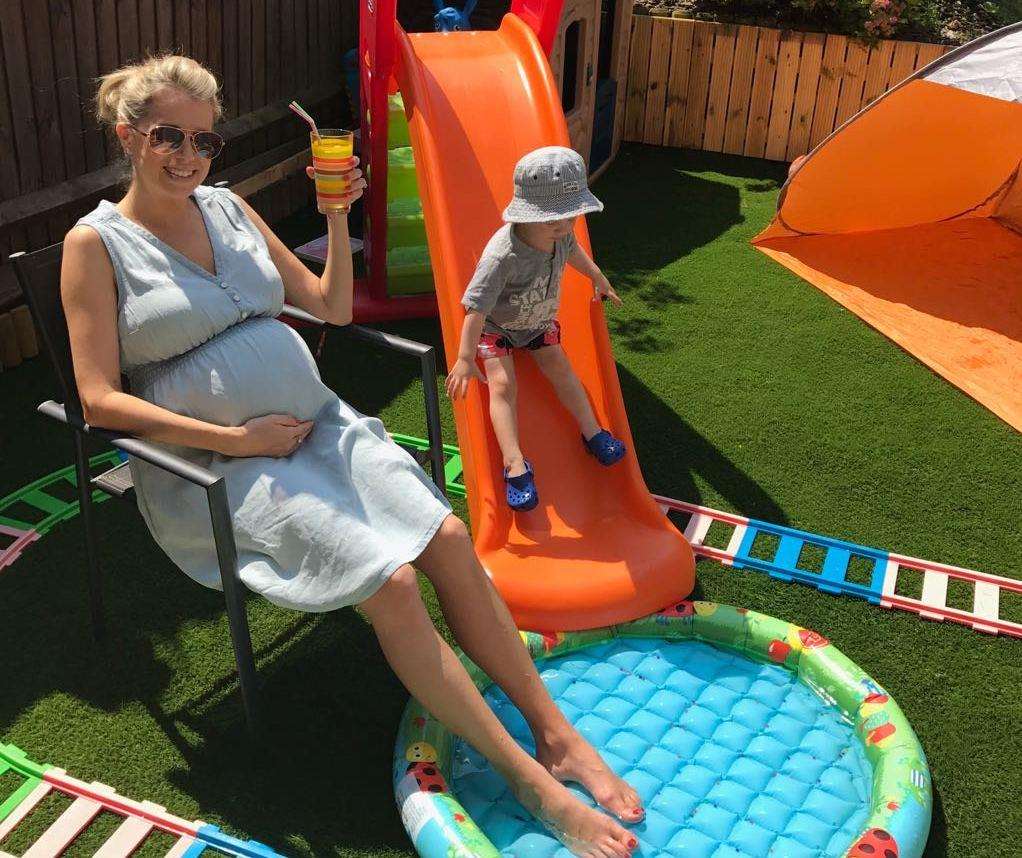 Cheers: With my £3 paddling pool last summer while pregnant