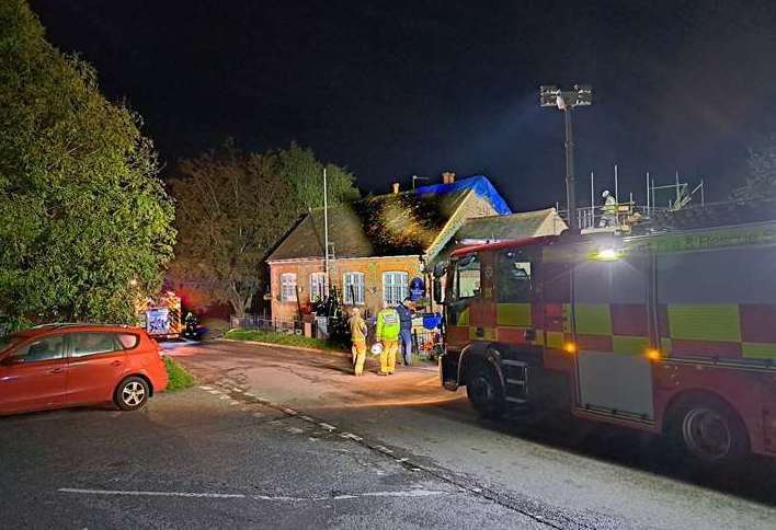 Fire crews and a group of villagers at Rodmersham Primary School following the blaze. Picture: Stock image