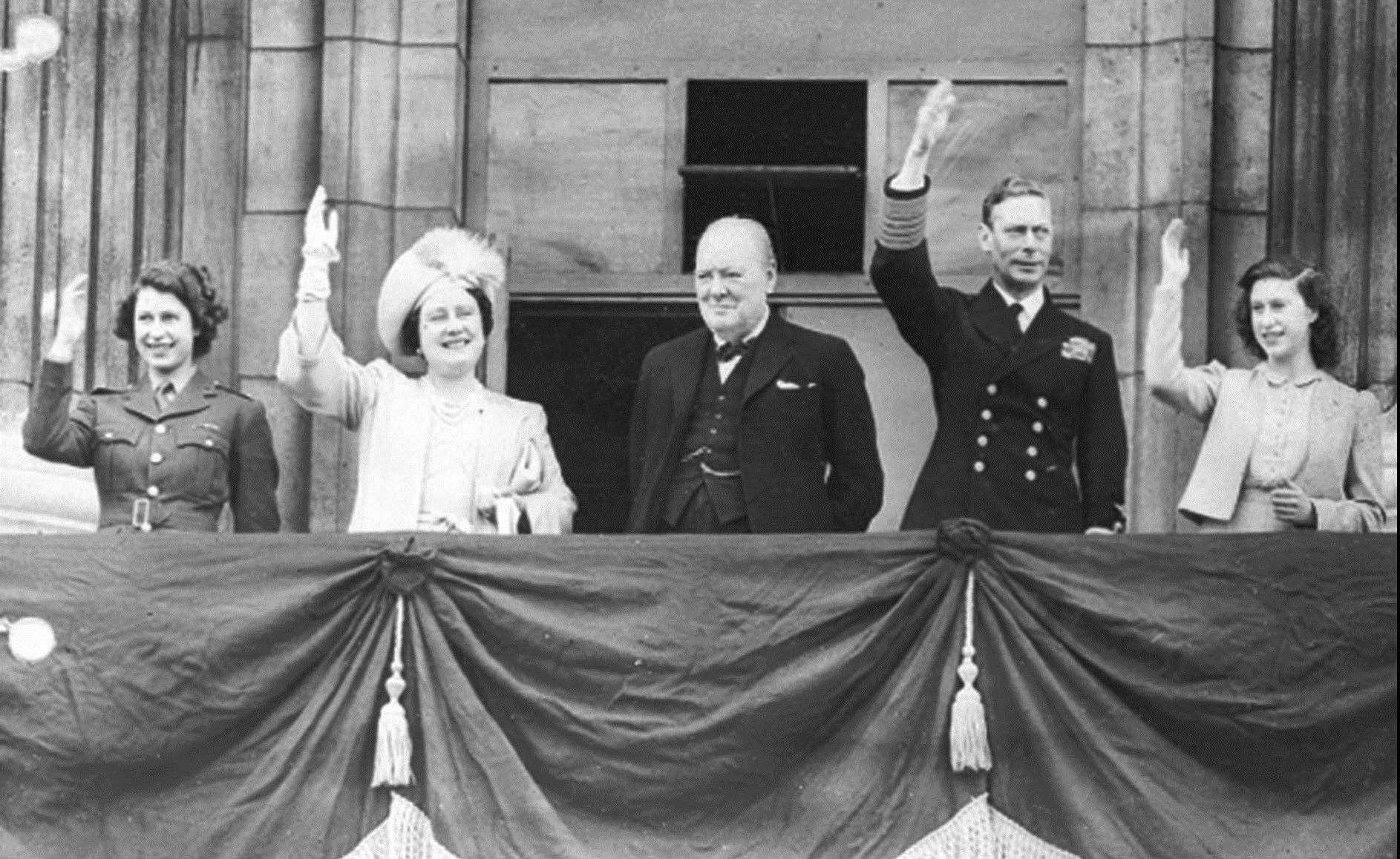 Prime Minister Winston Churchill with King George VI, Queen Elizabeth then-Princess Elizabeth (left) and Princess Margaret on the balcony of Buckingham Palace on VE Day, May 8, 1945