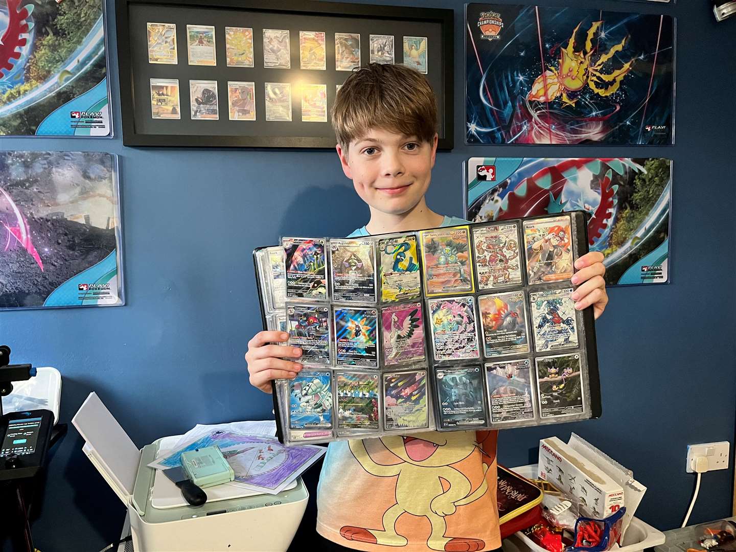 Harrison with just a few of his Pokémon cards