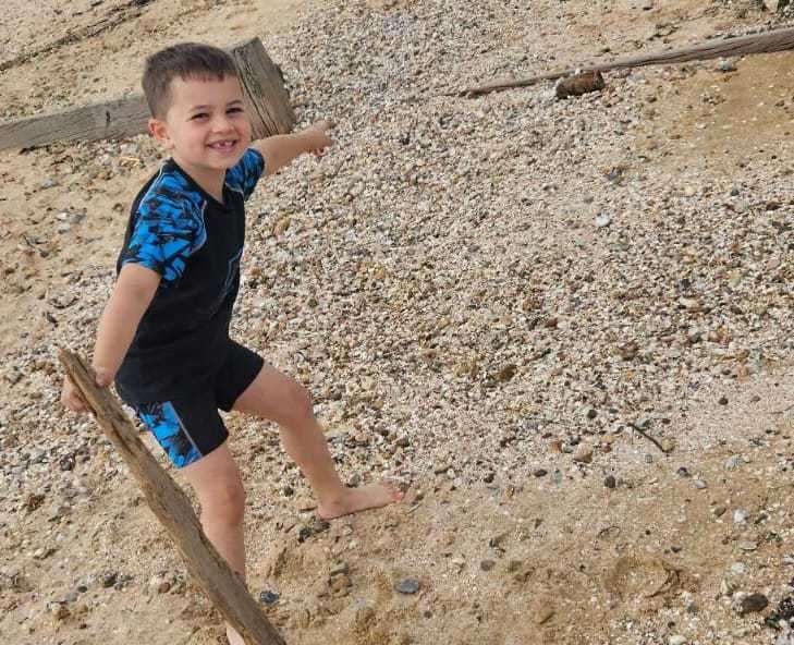 Harry Morrissey points to the artillery shell he found