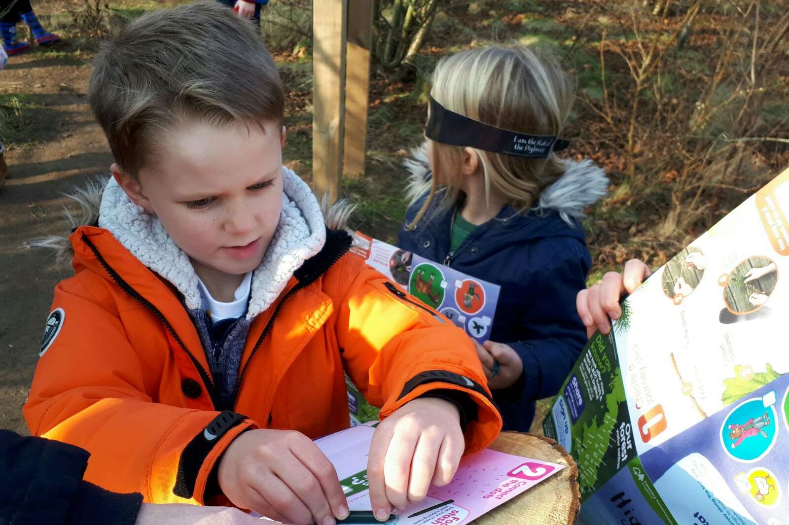 Oscar has a go at one of the stencil-rubbings found on the route.