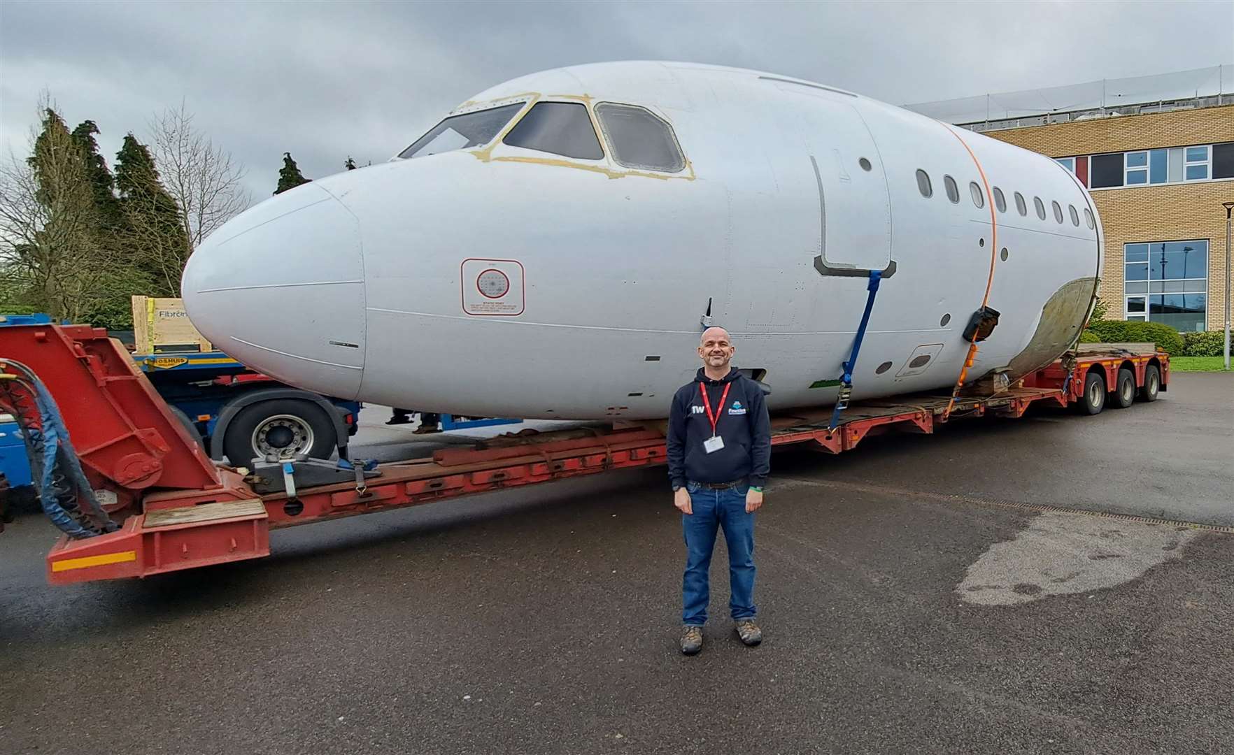 Head teacher Tim Williams with the cockpit and part-fuselage of an Airbus A319