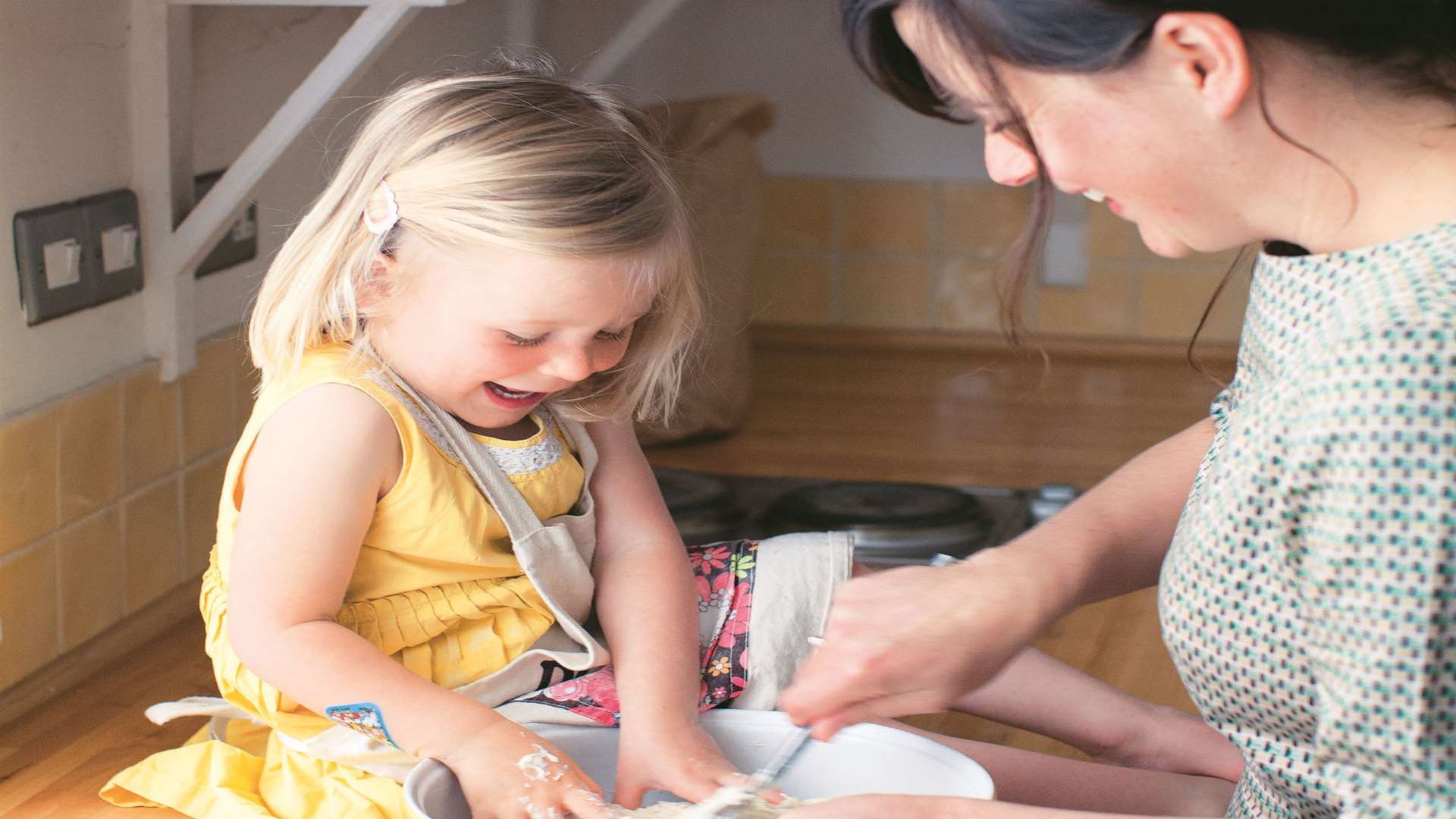 Claire Thomson in the kitchen with one of her daughters