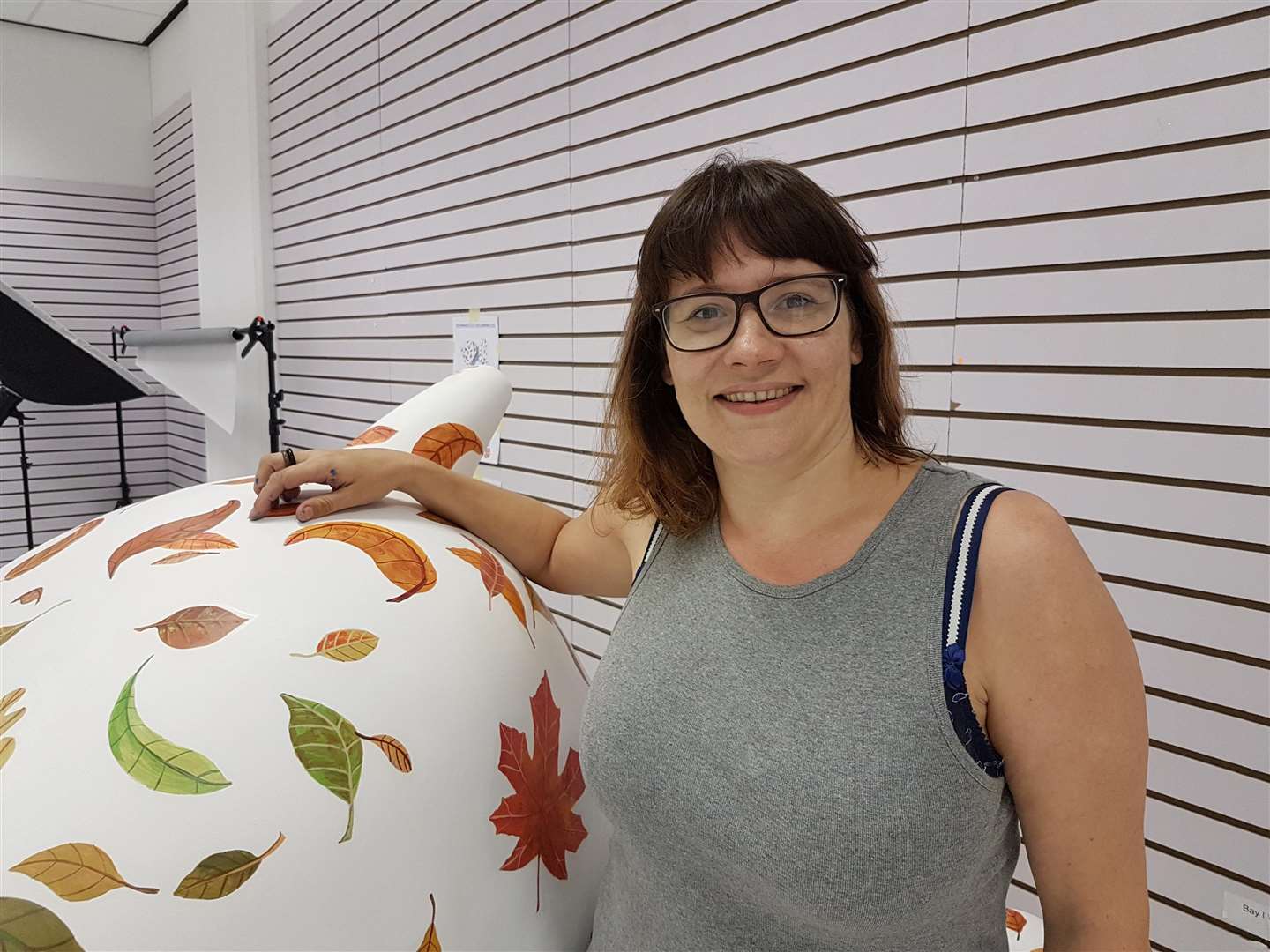 Artist Emma Dove with one of her two Snowdogs, Autumnal Tumble