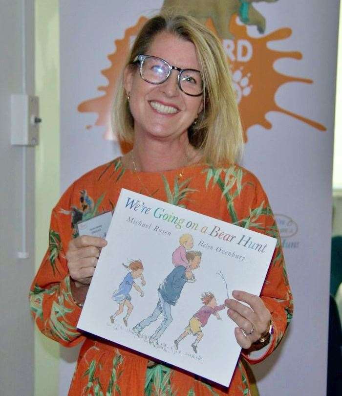 Sarah Harvey from Wild in Art holds up a copy of We’re Going on a Bear Hunt, the classic children’s book that inspired Dartford’s new sculpture trail.
