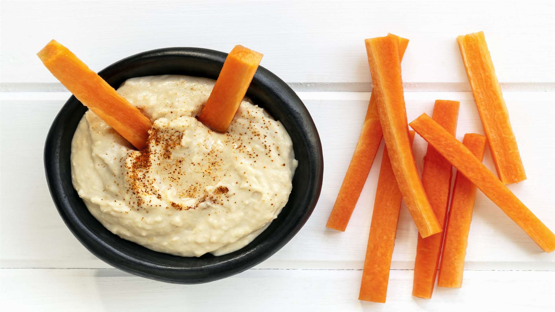Carrot sticks with hummus make a healthy snack