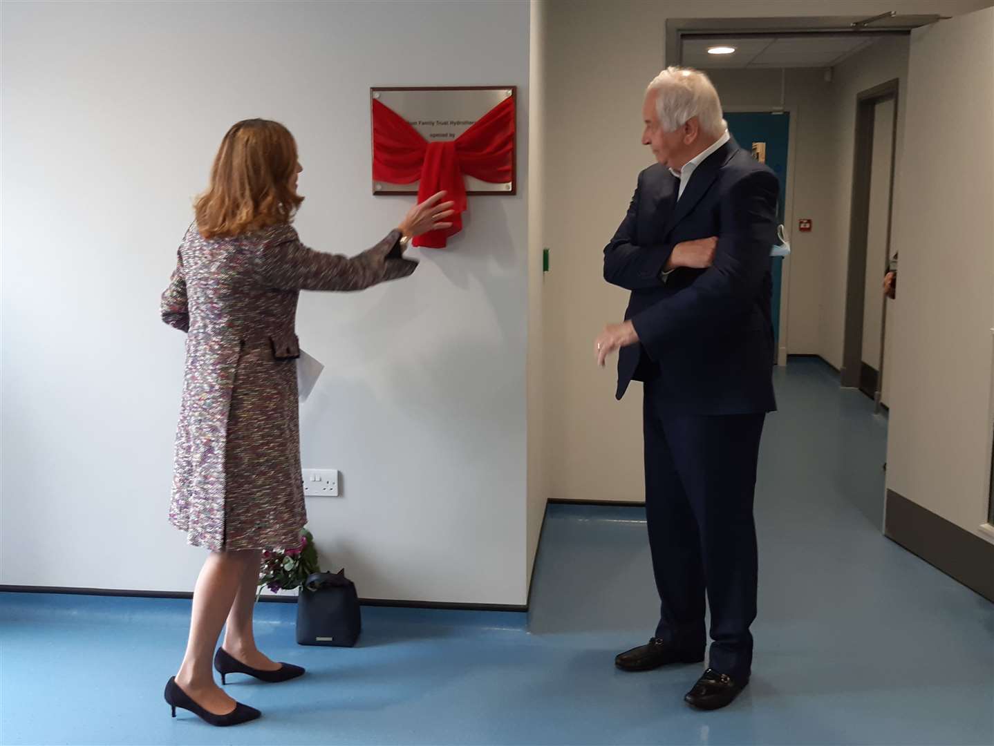 Lord Lieutenant of Kent, Lady Colgrain, unveils the plaque, commemorating the opening of the pool