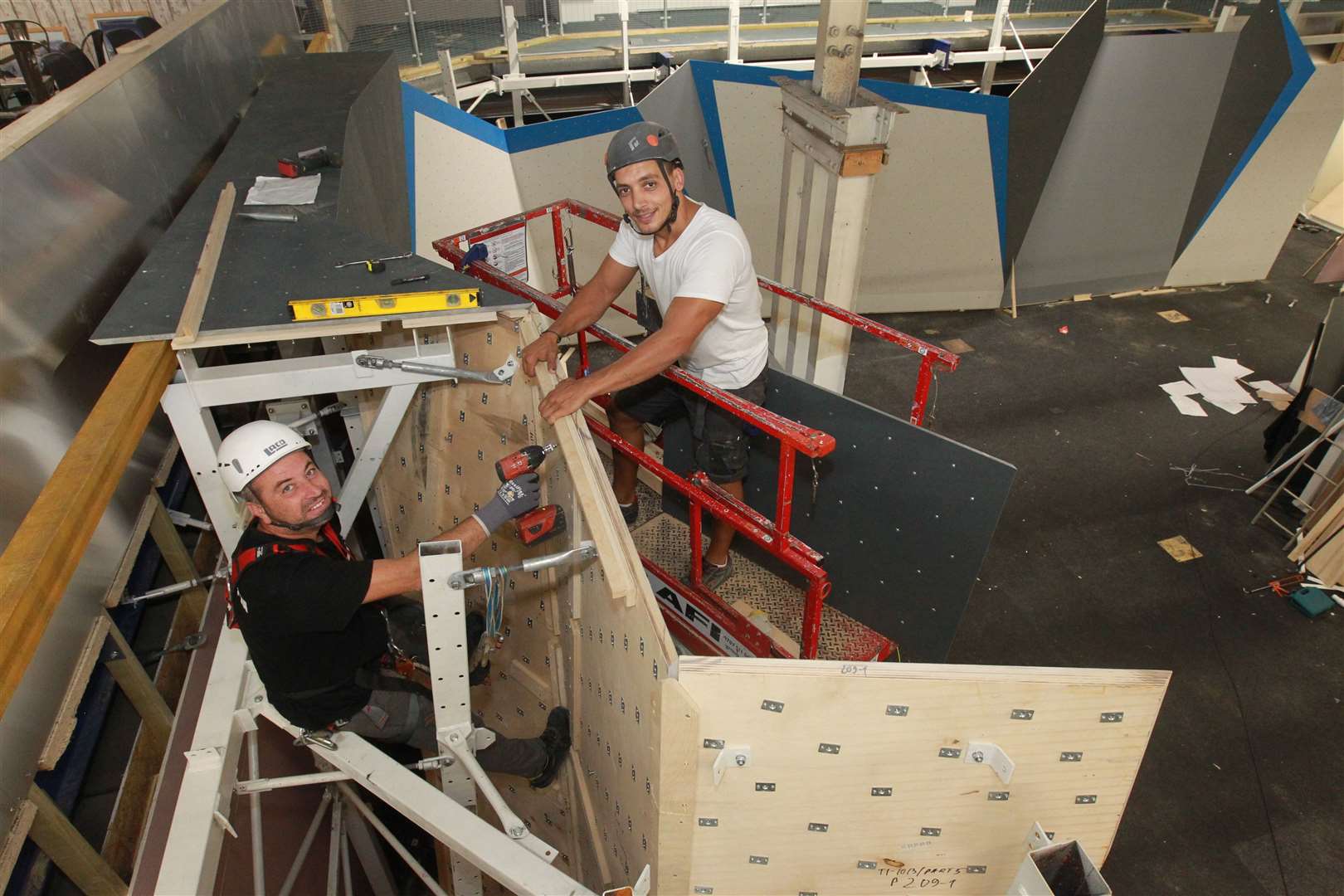 Daniel Miadenov and Stoycho Grozev, from Walltopia, helping to put together climbing walls at The Climbing Experience