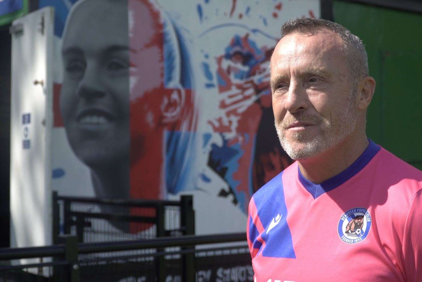 Bearsted Football Club chairman Jamie Houston next to the mural of Alessia Russo. Picture: KMTV