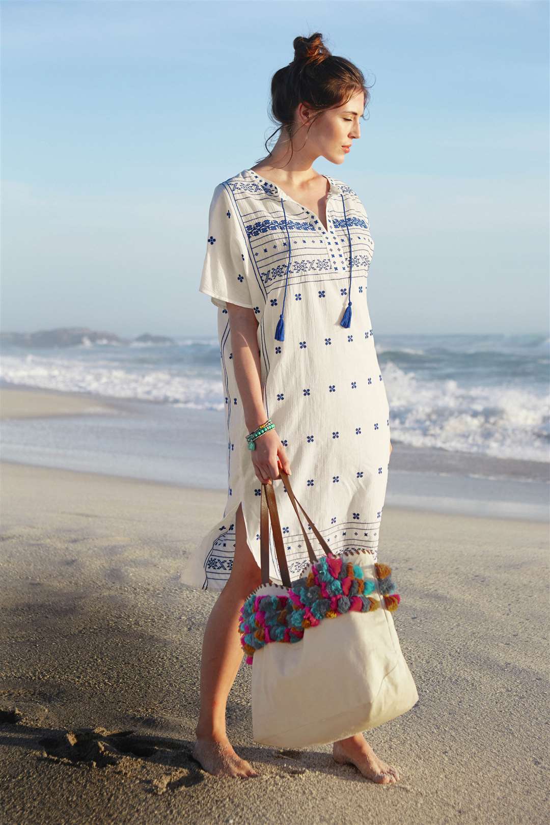 White Stuff Shipwreck Embroidered Kaftan, £22 (reduced from £45); Laurie Tassel Tote Bag, £29 (reduced from £59.95)