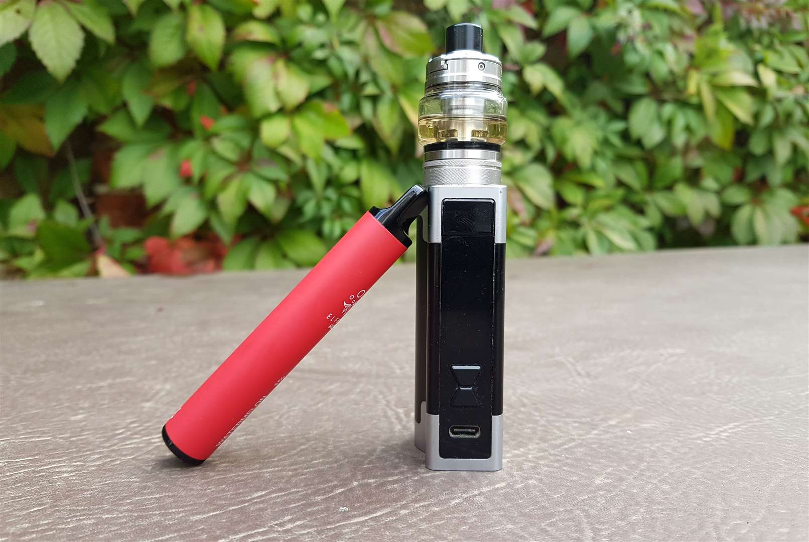 The traditional tank vape device - with the new breed of disposable leaning against it. Image: Stock photo.