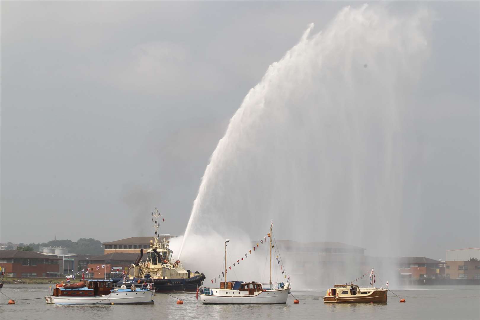 A fire boat shoots water in the air at The Medway River Festival