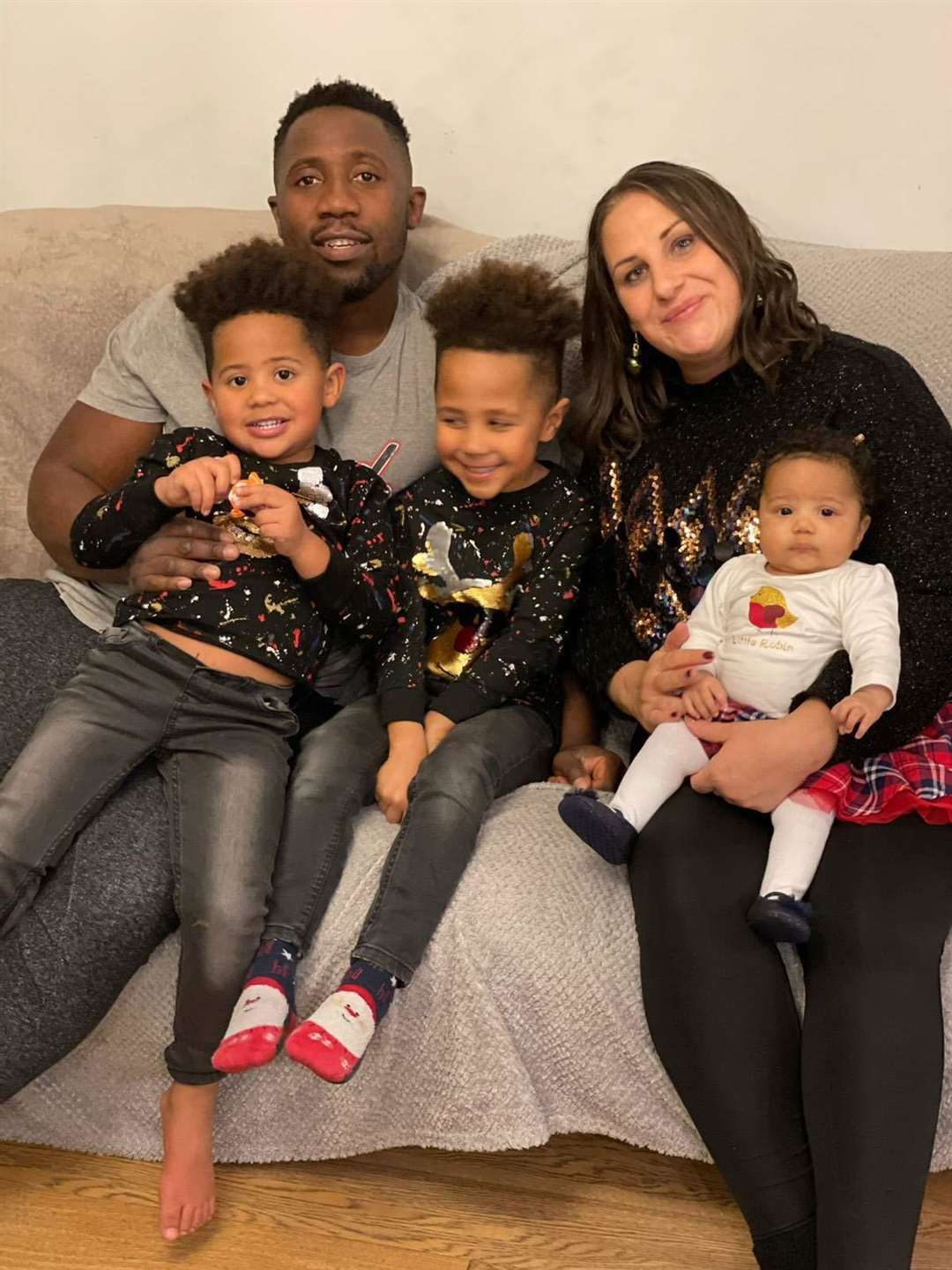 Samantha Savill with partner Farai Mutepfa and their children Zak, Leo and Molly