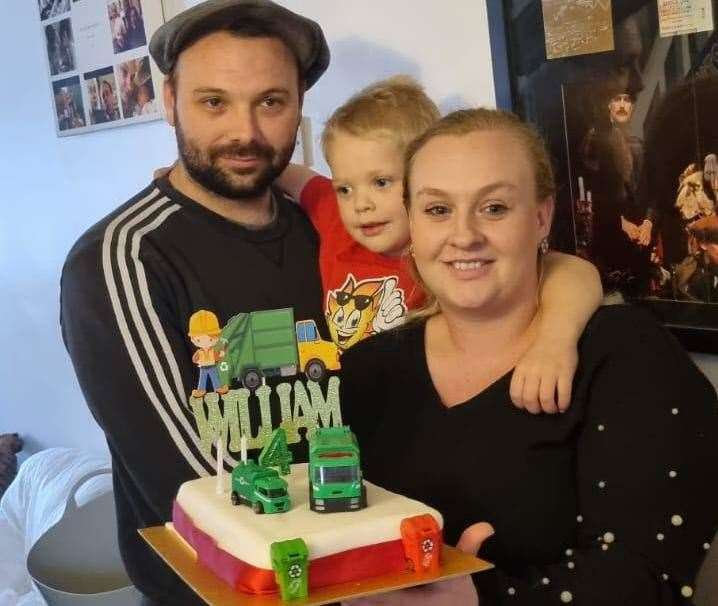 William with his dad Bill, mum Caitlin and his fourth birthday cake
