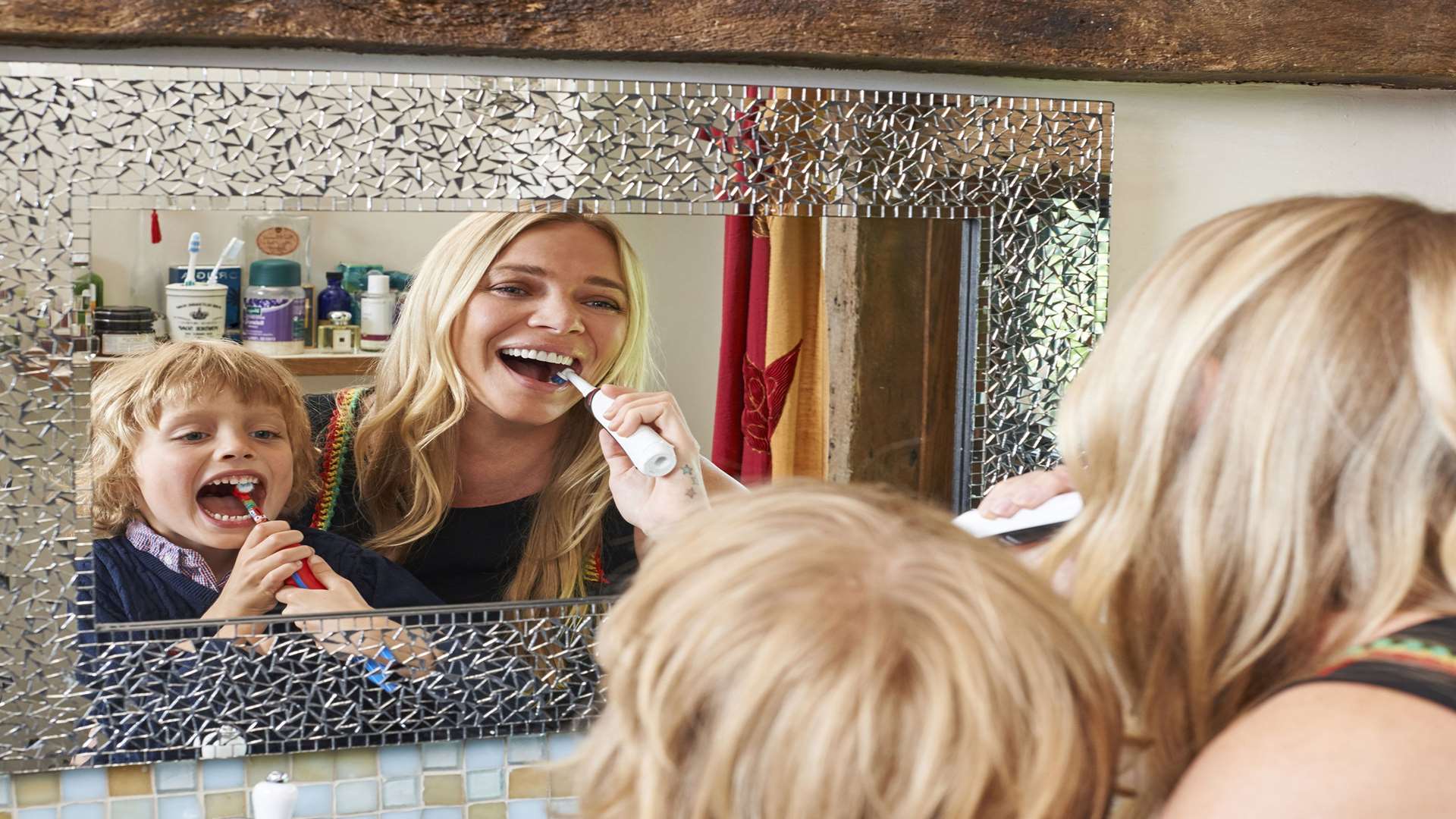 Jodie Kidd brushing her teeth with her son Indio