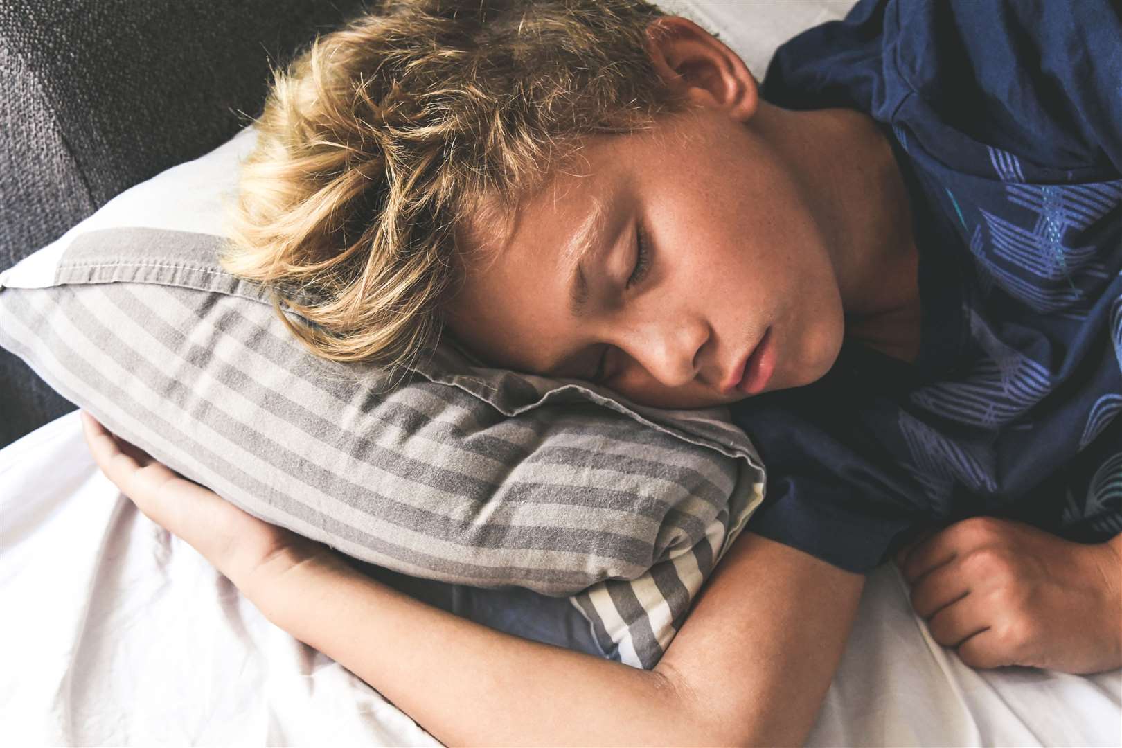 Paying attention to clothing and bedding can help children feel cooler at bedtime