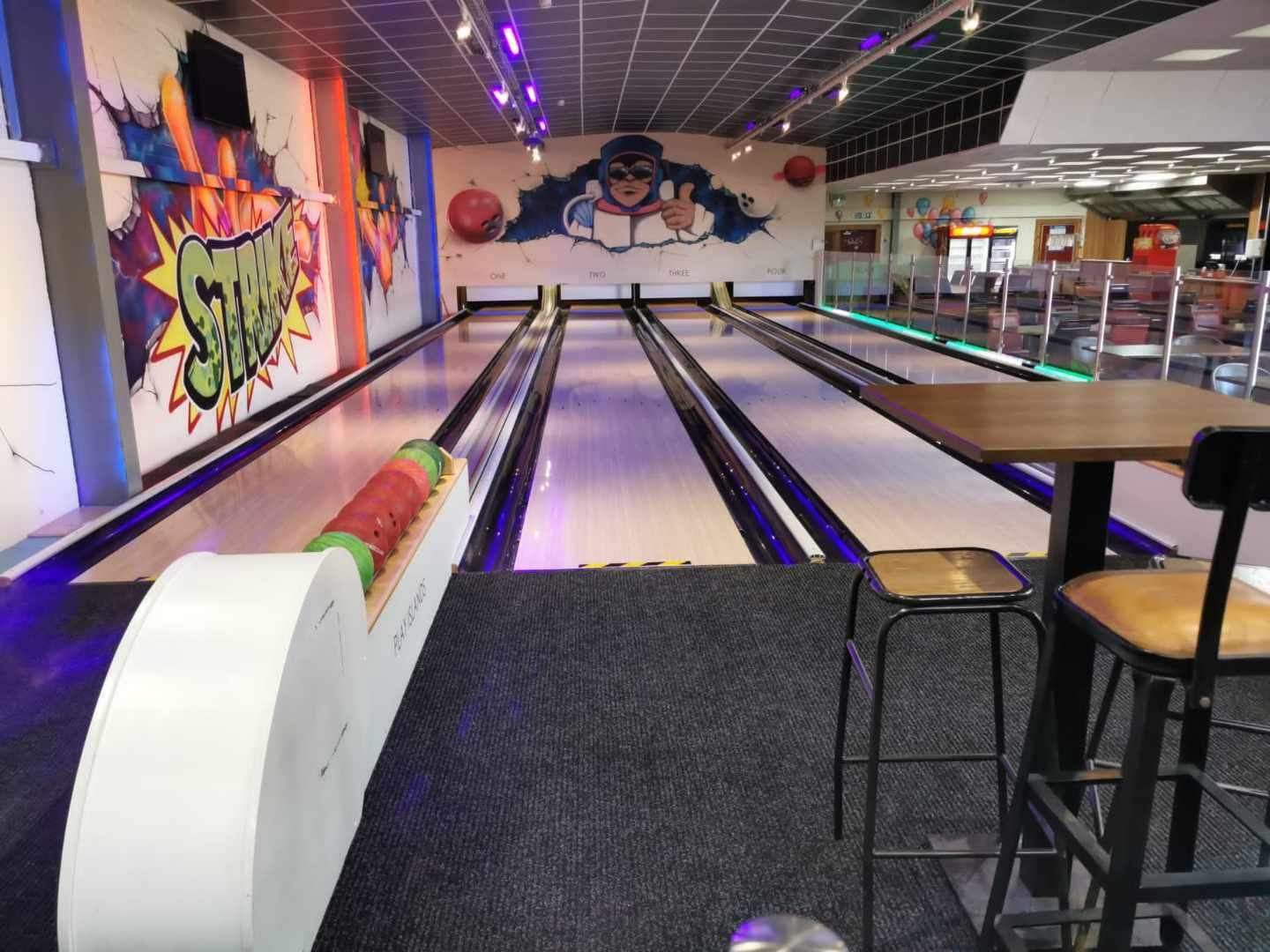 The 10-pin bowling alley has four lanes