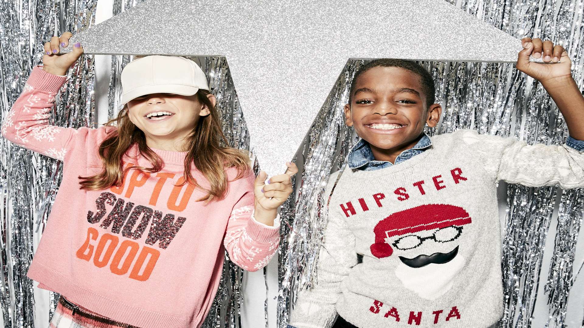 Up To Snow Good pink sequin jumper £18 and Hipster Santa jumper £14. Both from River Island