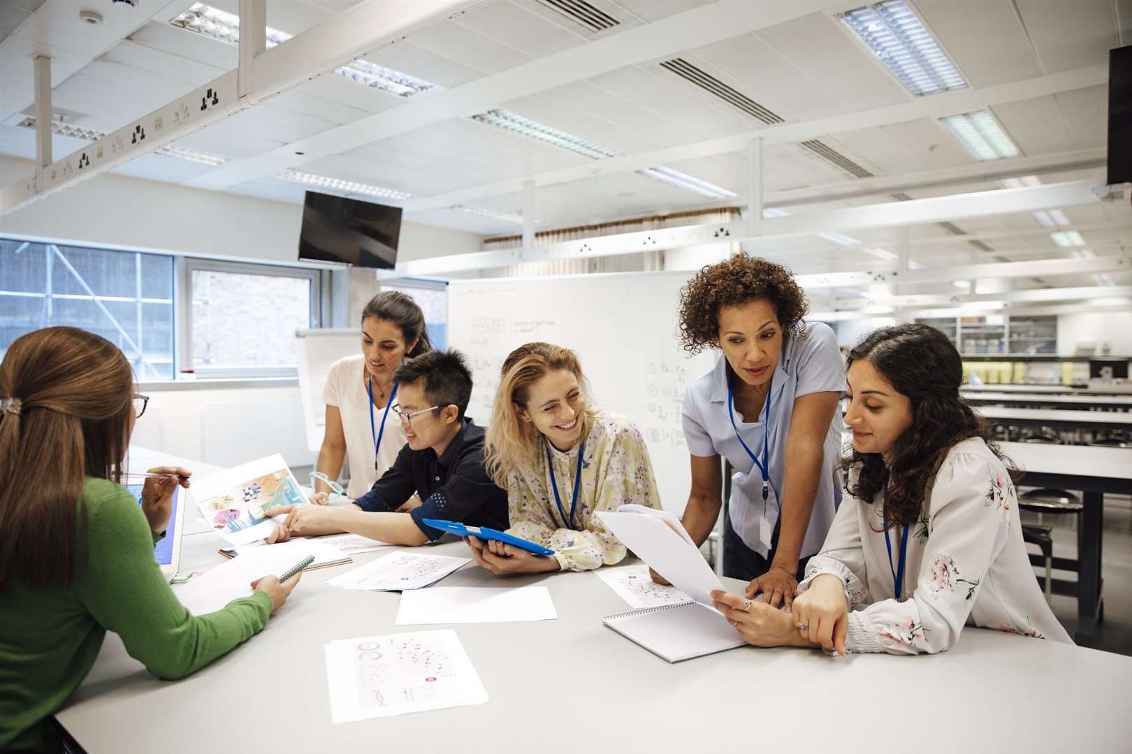 Teacher with a group of students in a laboratory classroom