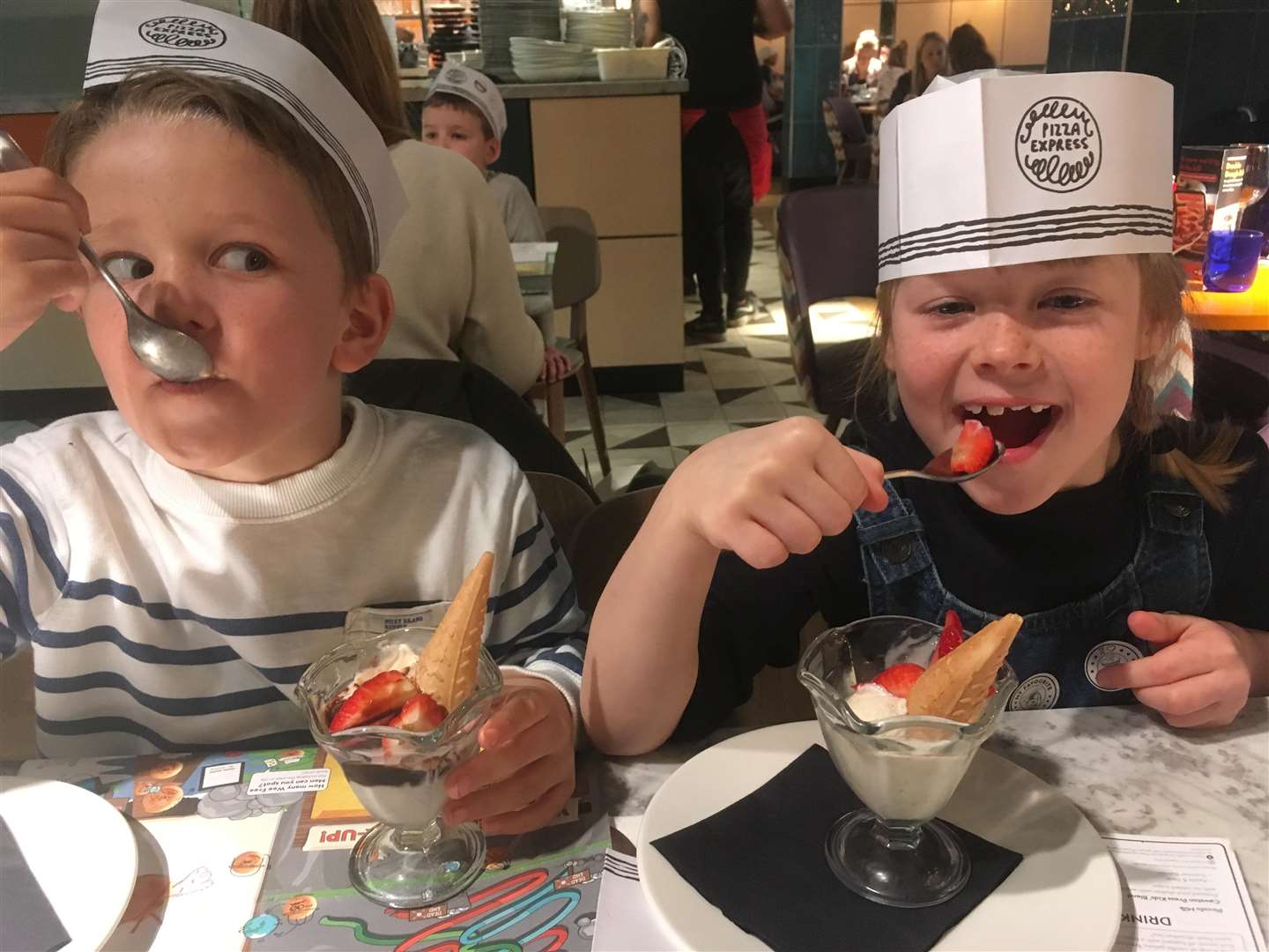Oscar and Amber, both 7, enjoy their well-deserved puddings.