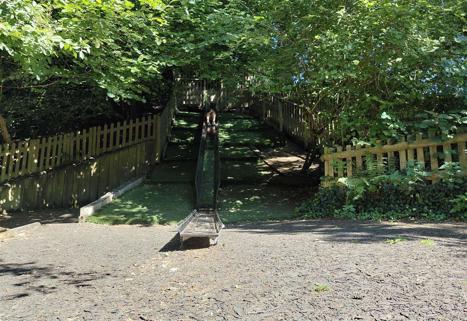 The park has a slide built into the hill