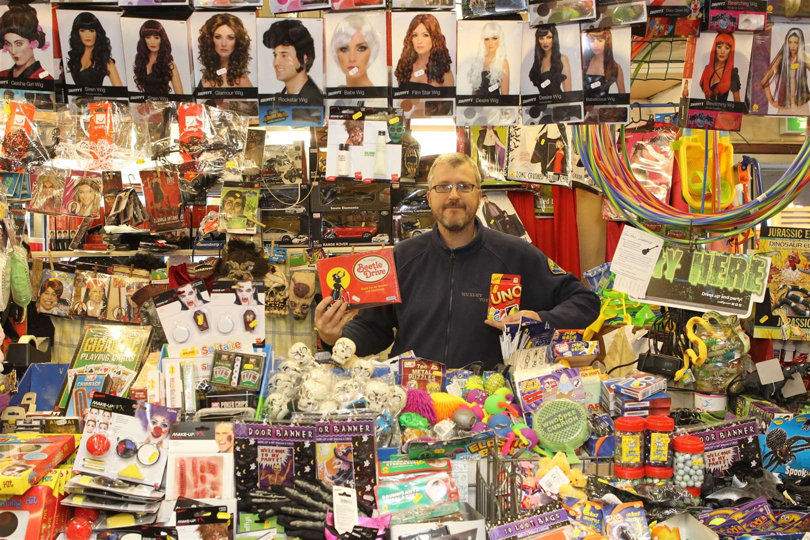 Richard Ray, Manager of Nuxley Toys surrounded by lots of the toys his shop sells