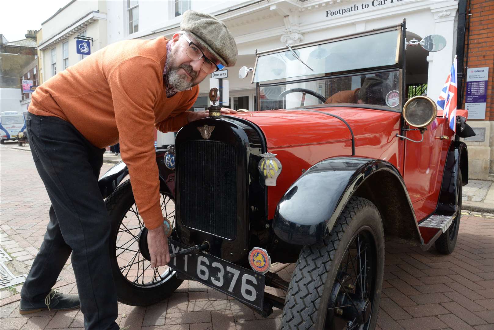Tony Roberts starts his 1926 Austin 7 Chummy using the starting handle at last year's Transport Weekend in Faversham