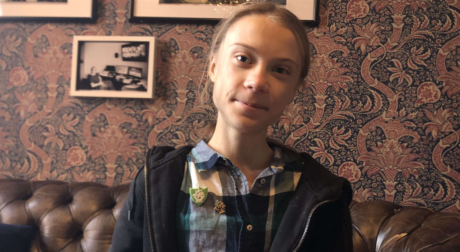Greta Thunberg displays her Gold badge in her virtual award presentation