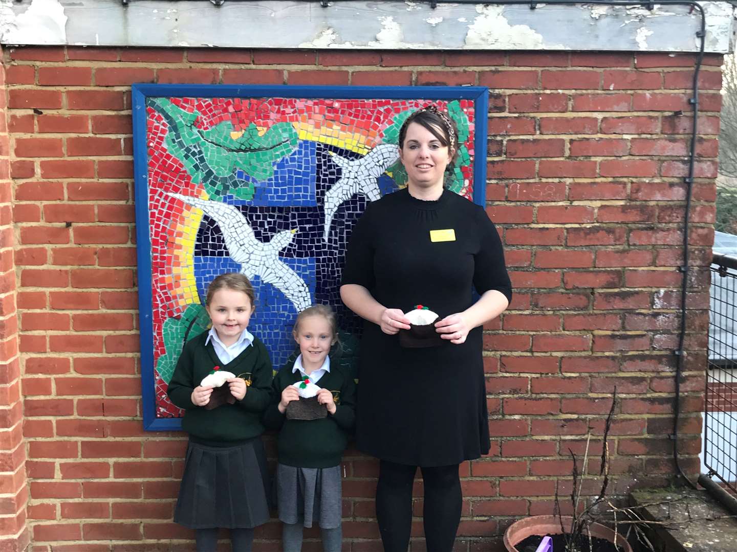 Holly and Georgiana with Cat Leigh and the festive hats for newborns. Picture: MTW