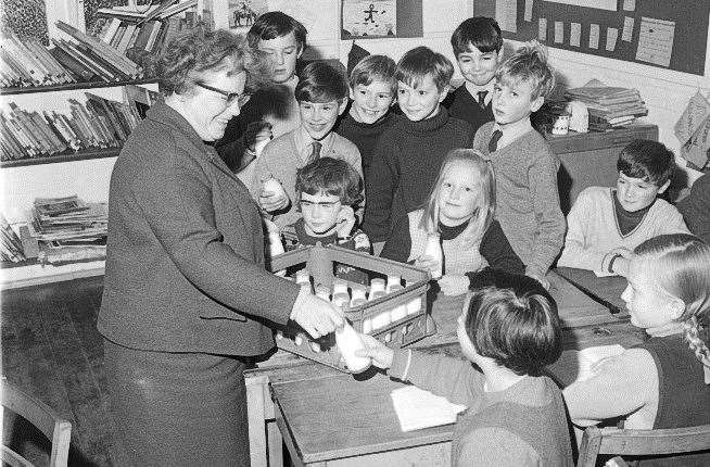 Pupils in November 1969 receiving their bottles of school milk