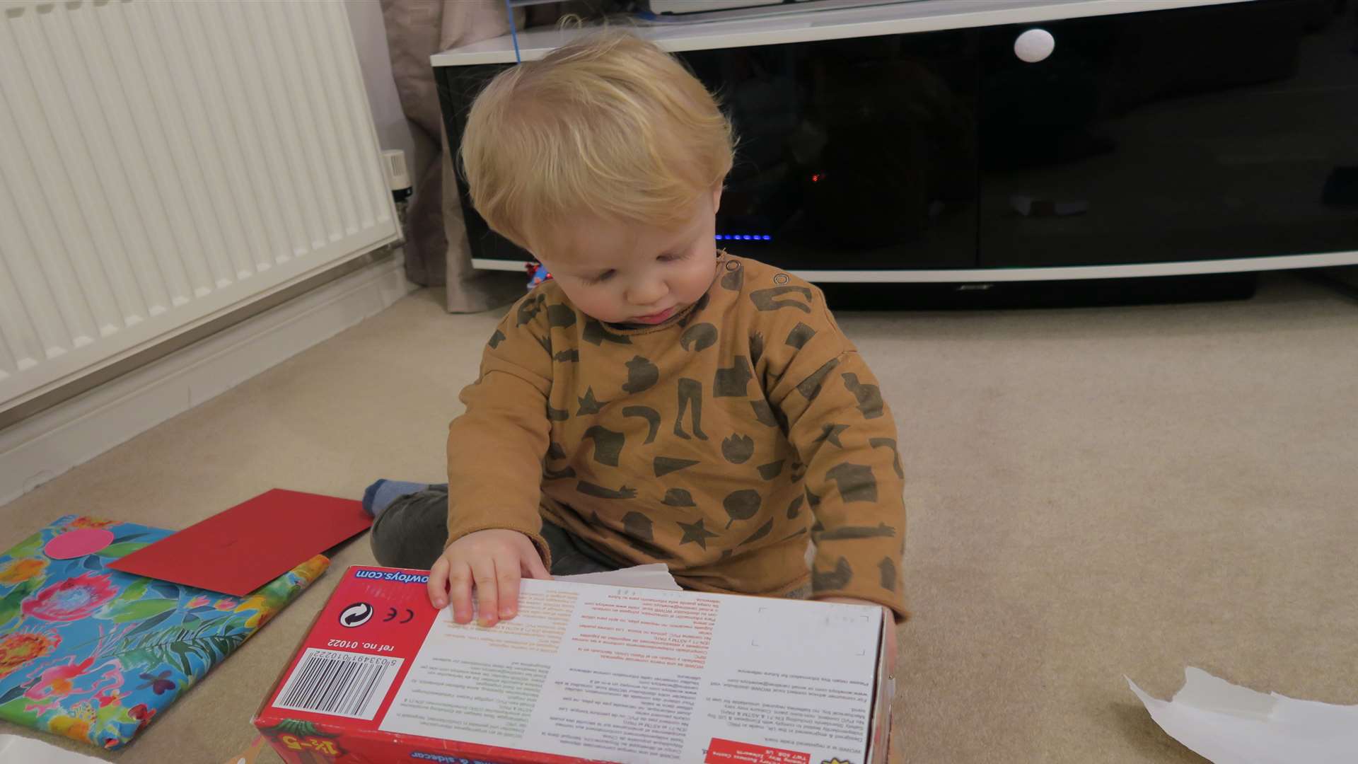 Noah opening presents on his second birthday