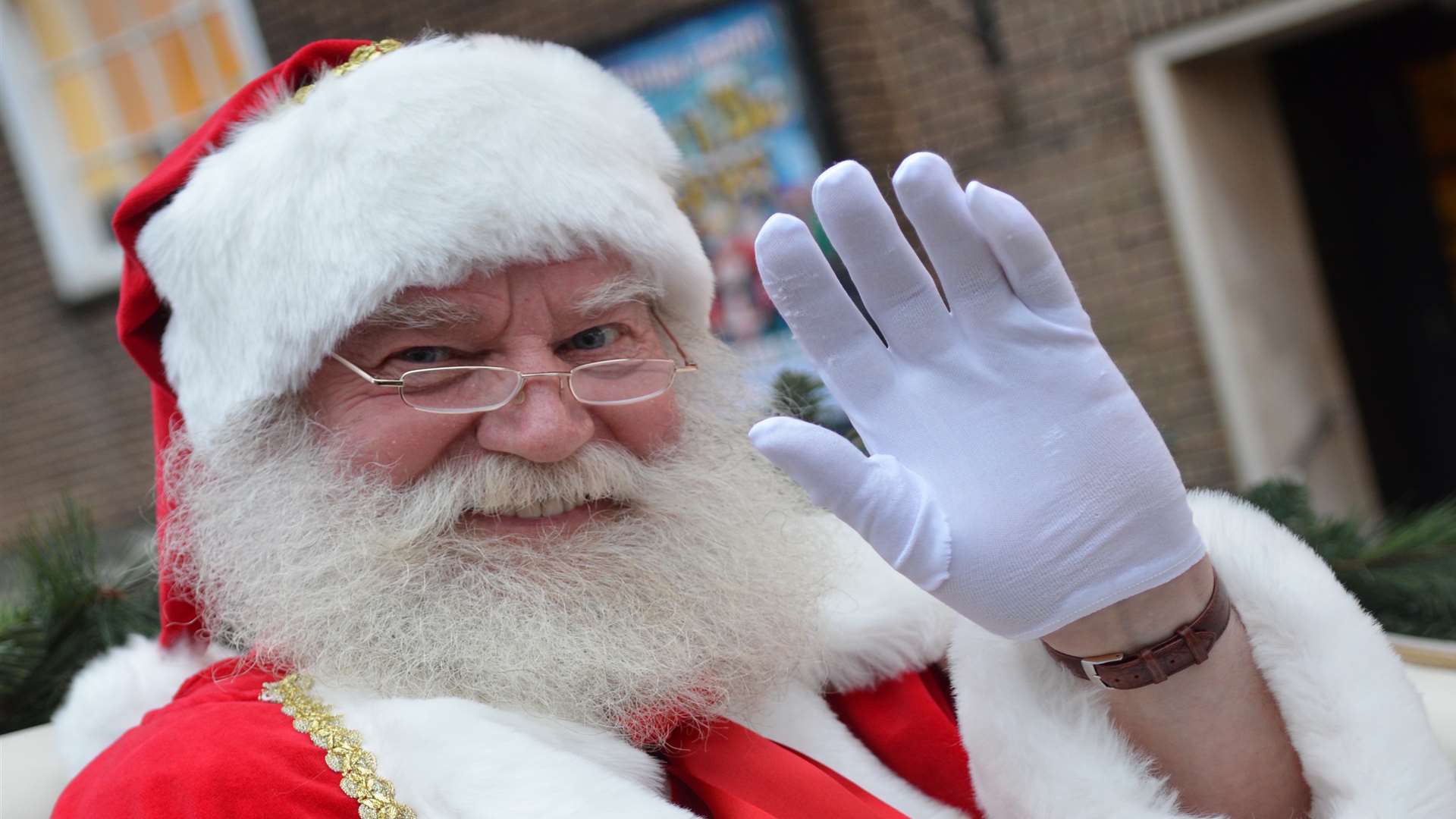 Father Christmas waves to the crowds at the lights switch on