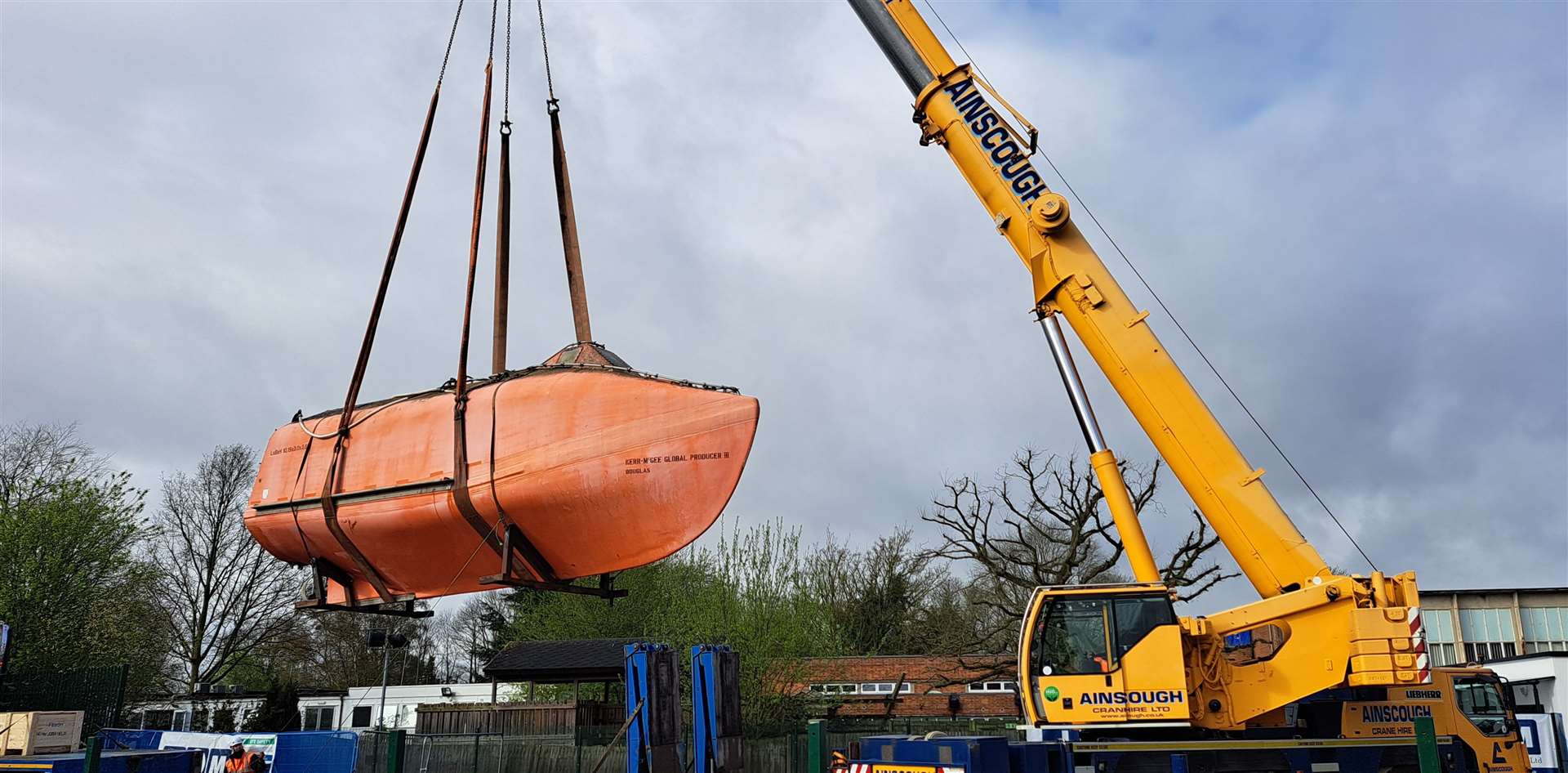 The lifeboat is craned into position