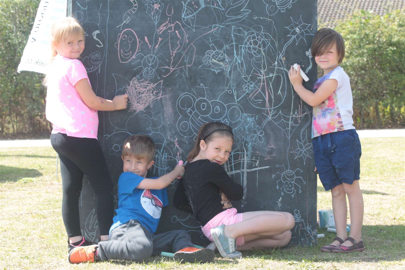 Youngsters do some chalk art, at Art in the Park in Milton Creek Country Park