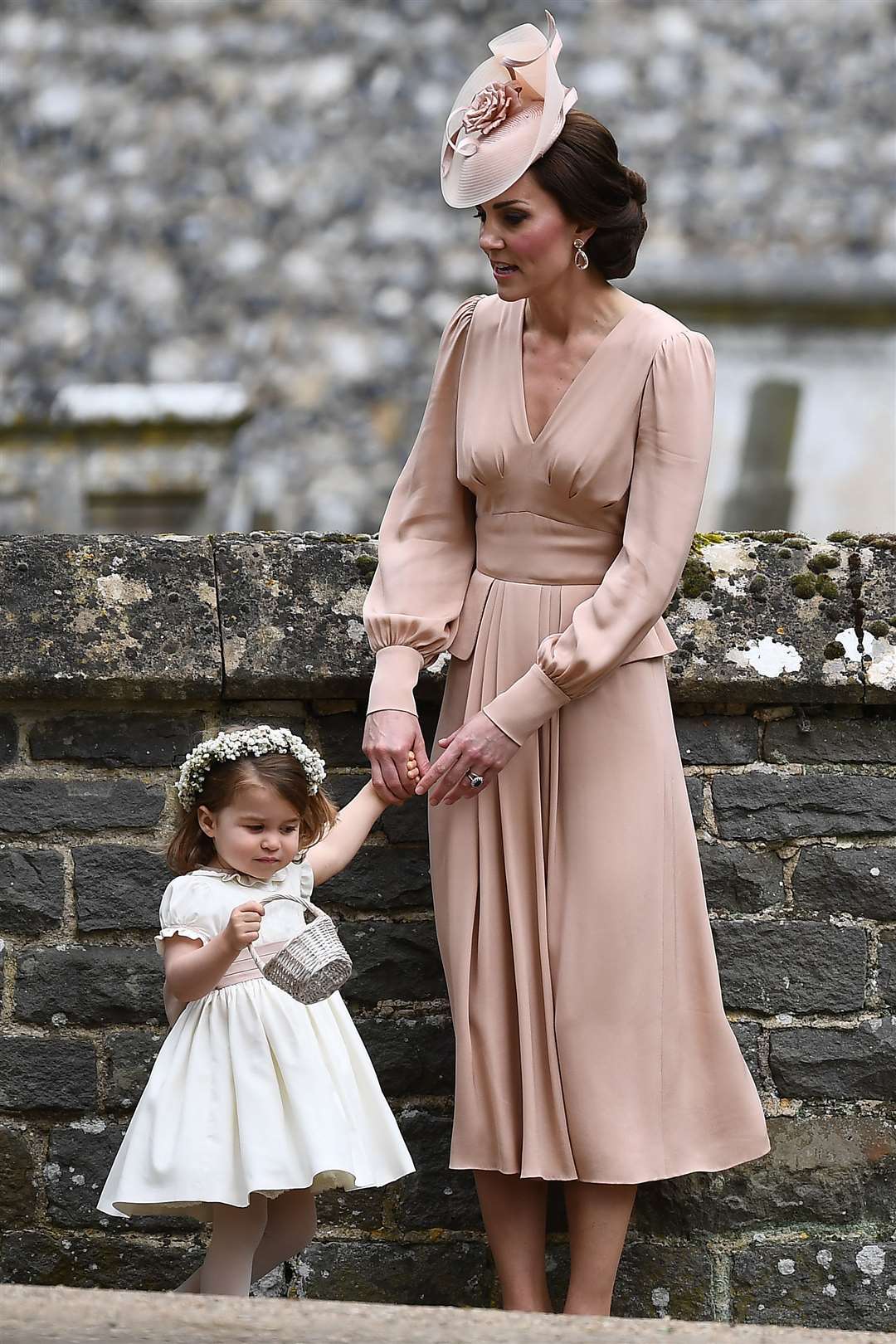 The Duchess of Cambridge with her daughter Princess Charlotte at the wedding of Pippa Middleton and James Matthews