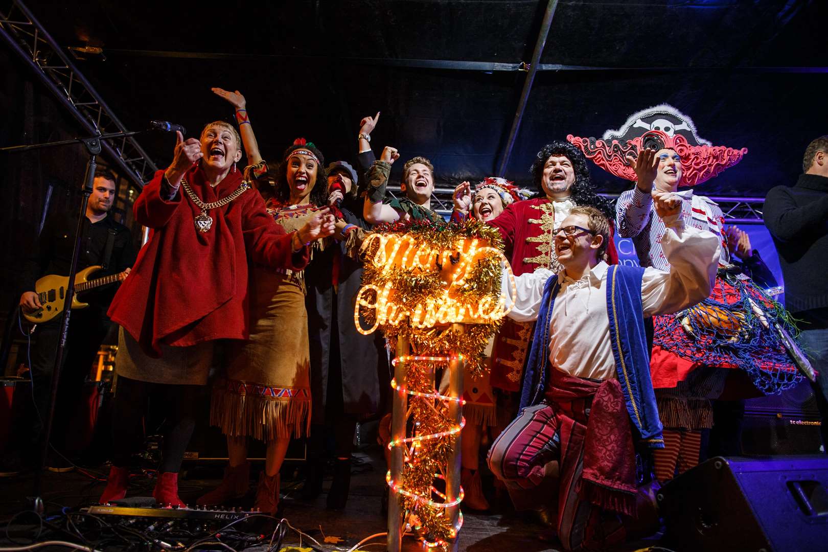 The pantomime cast of Peter Pan turning on the lights in 2017