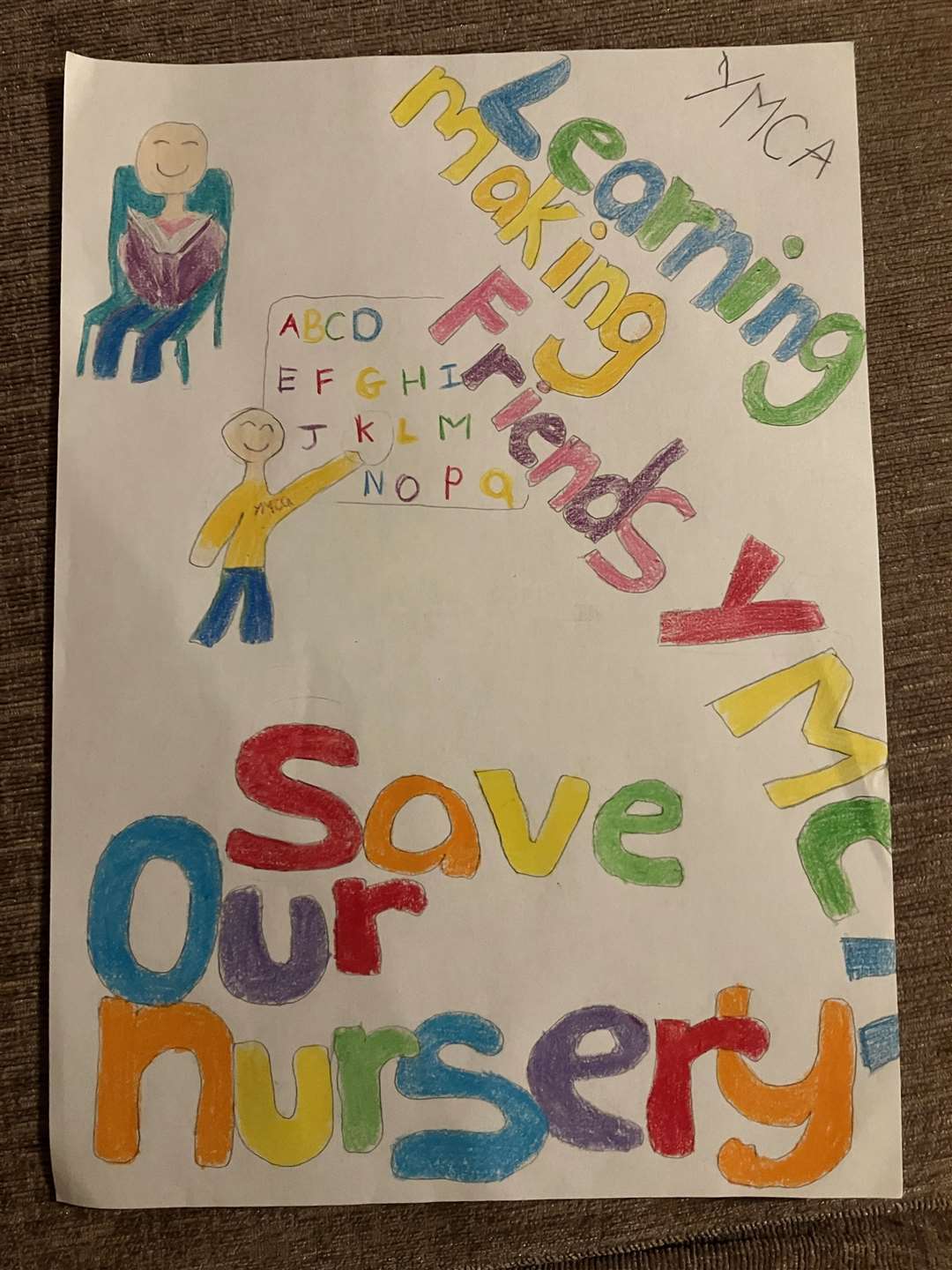The children made posters in the hopes of saving their nursery. Picture: Kelly Cattermole